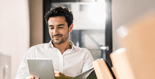 A marketing lead reviewing customer data on a tablet