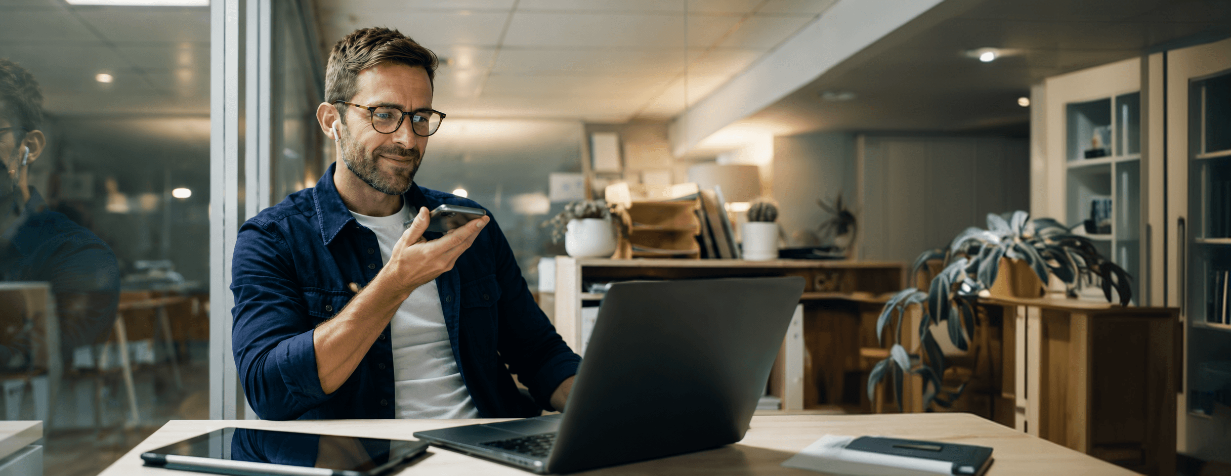 A man on a call with the customer's history already in hand