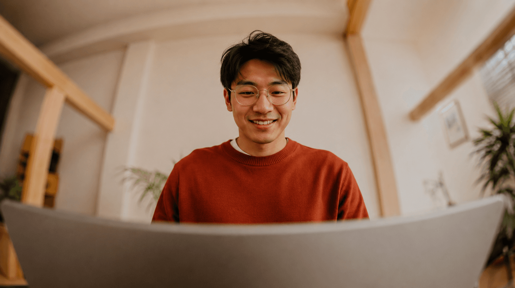 A person smiling on a video call